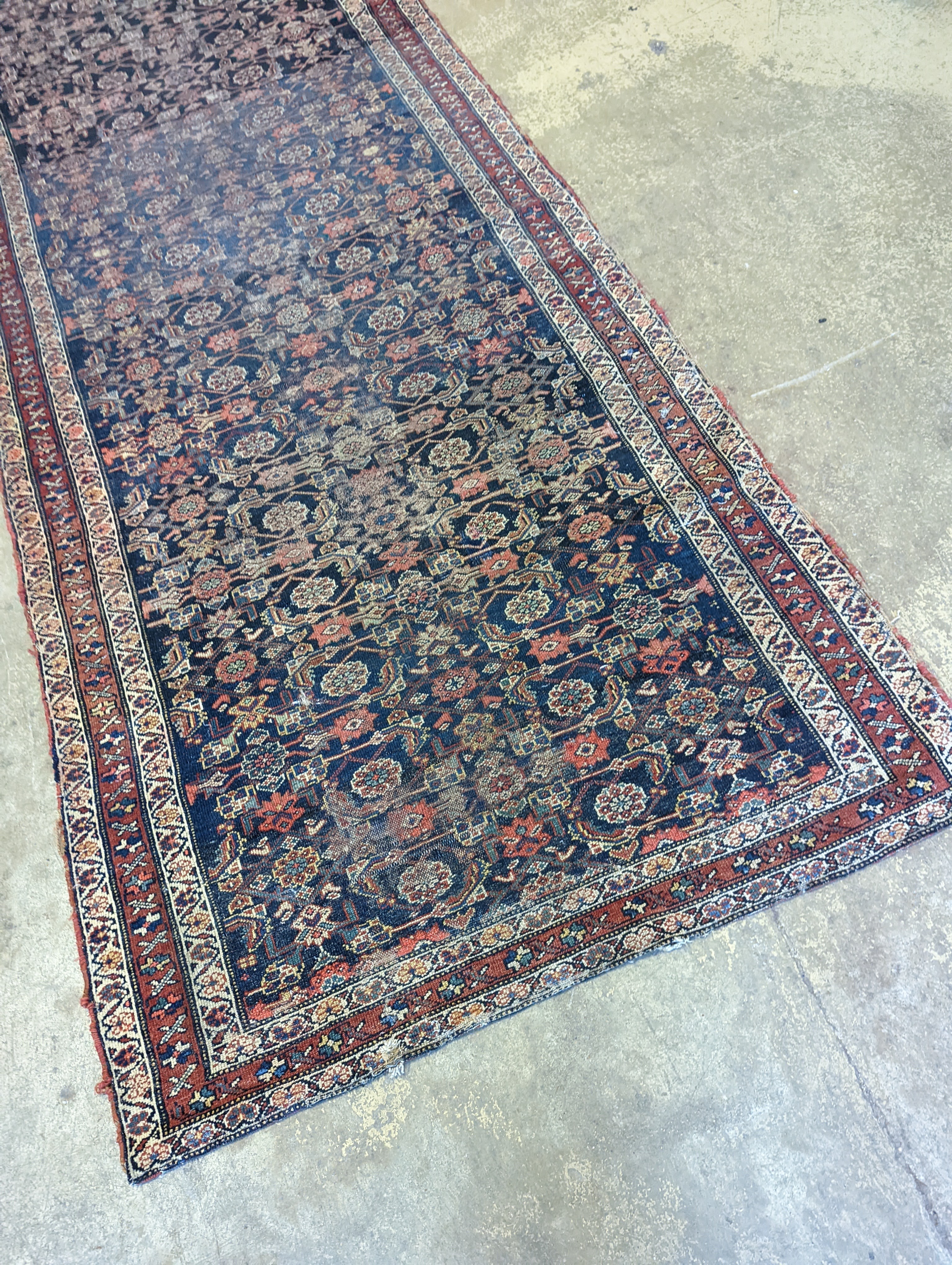 An antique Shirvan blue ground runner, 470 x 116cm